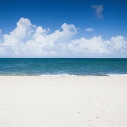 On the beach, sun loungers, beach towels