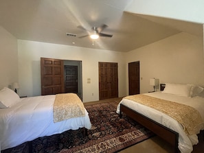 Upstairs bedroom with two Full size (double) beds and attached bathroom