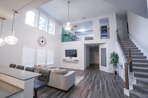 Living Room - HouKnew Retreat: 4BR Movie & Game Room Loft 10 mins from the Heart of Houston! (Houston)