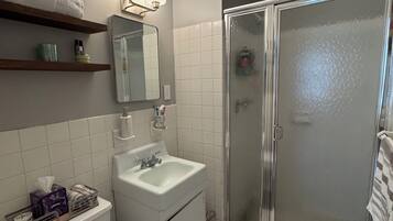 Bathtub, hair dryer, towels, soap