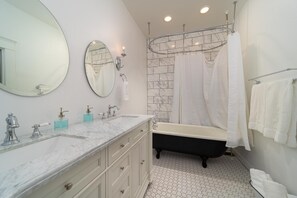Combined shower/tub, hair dryer, towels, soap