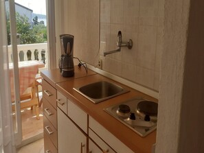 Apartment (Two Bedroom Apartment with Terrace an) | Private kitchen | Fridge - Apartments Biserka (Rab)