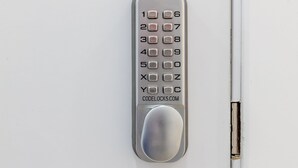 A numeric keypad lock on a white door. - AYZ Silvela - Auto check-in property (Málaga)