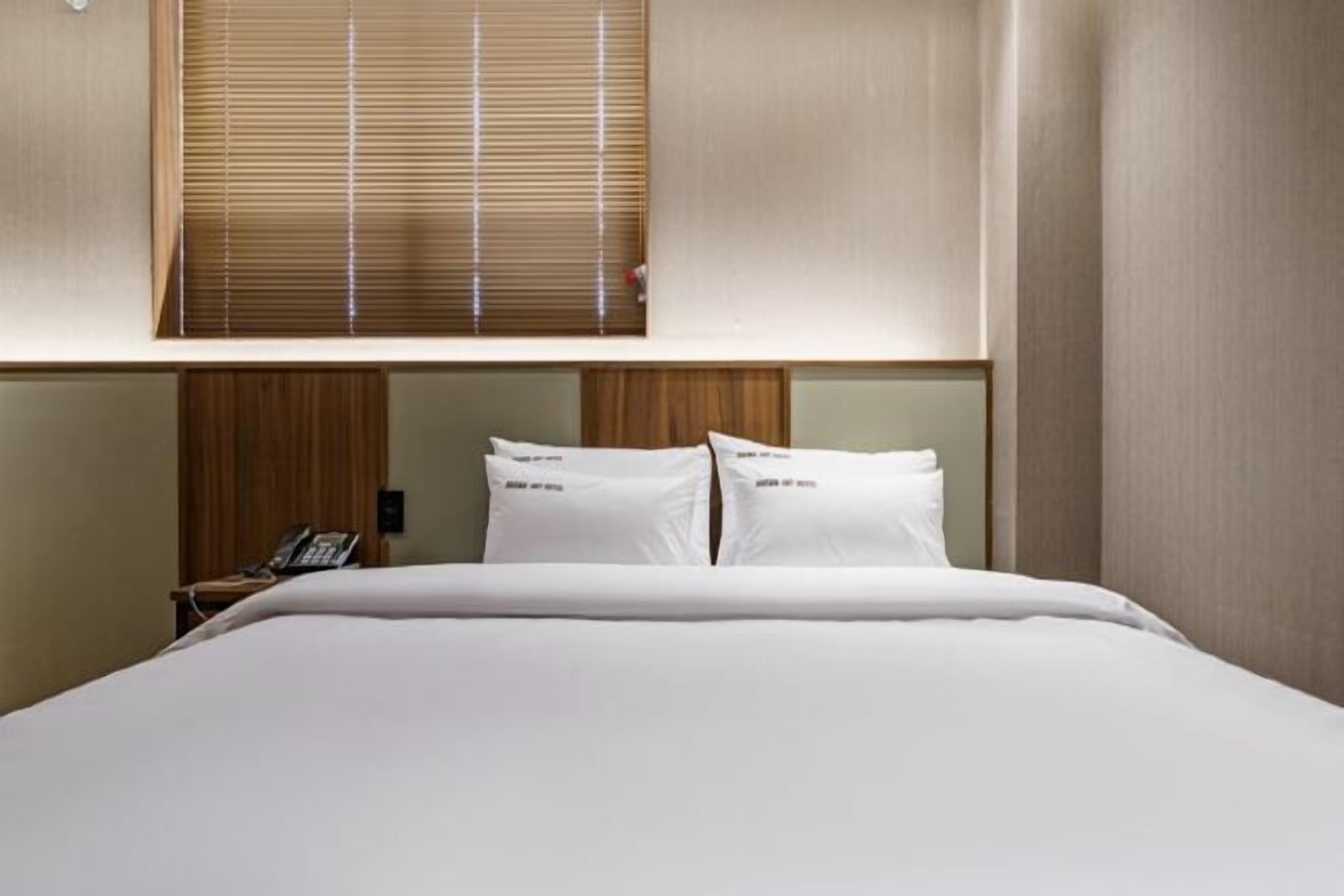 Premium bedding, down comforters, pillowtop beds, minibar