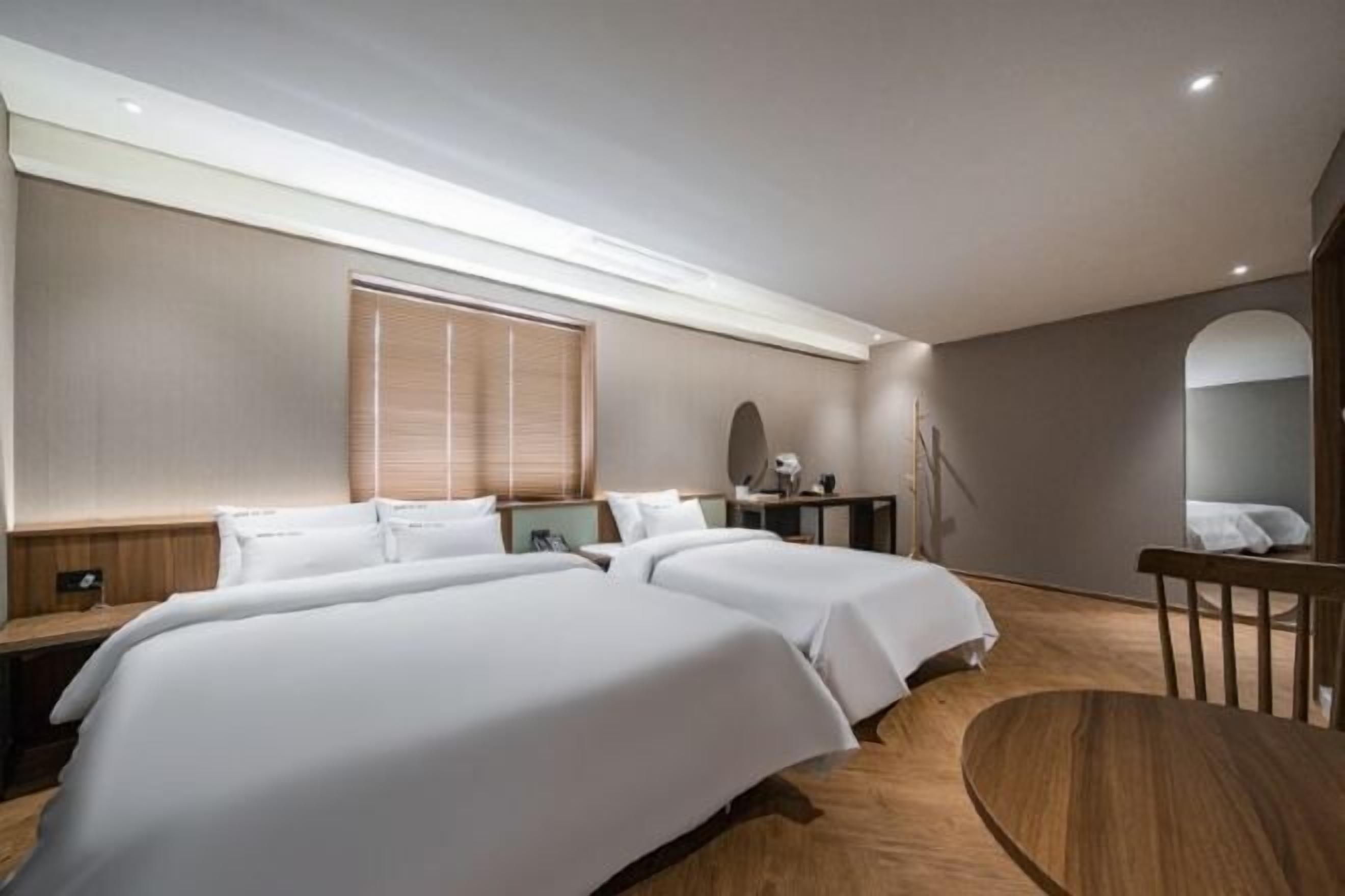 Premium bedding, down comforters, pillowtop beds, minibar