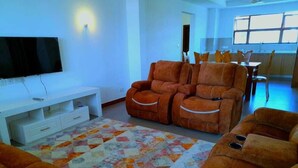Luxury Apartment | Living area | 14-inch Smart TV with digital channels, TV - Stay.Plus sultan Palace Penthouse (Mtwapa)