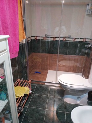 A bathroom with a shower, toilet, and a tiled floor. - Colunga Costa Verde Asturias. Apartment 4 people (COLUNGA)