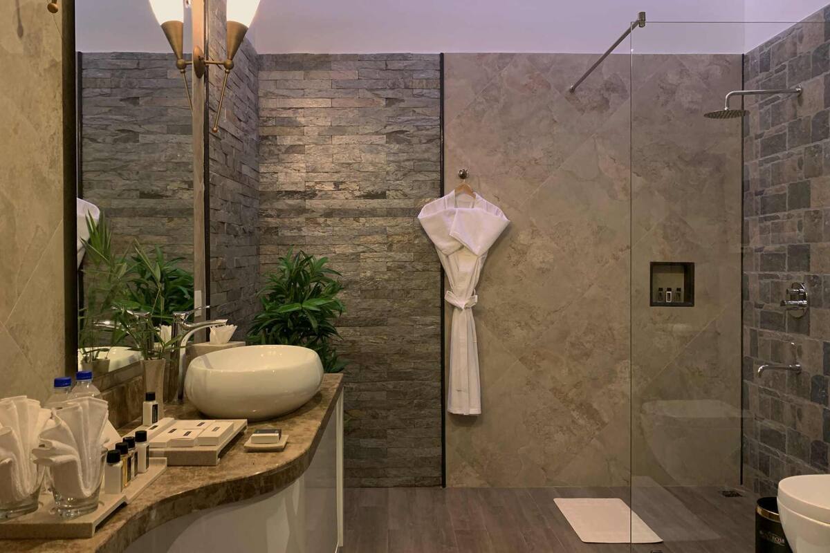 Bathroom | Shower, rainfall showerhead, designer toiletries, hair dryer