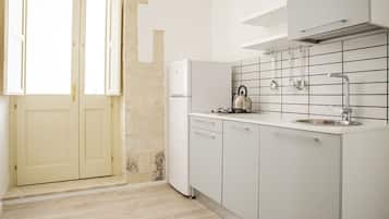 Fridge, cookware/dishes/utensils, dining tables