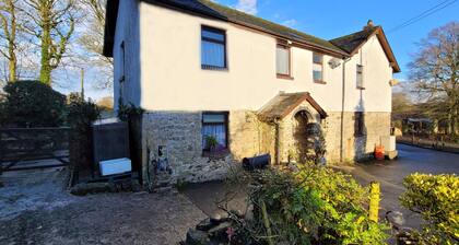 Comfortable character cottage with small garden on smallholding. Pets welcome.