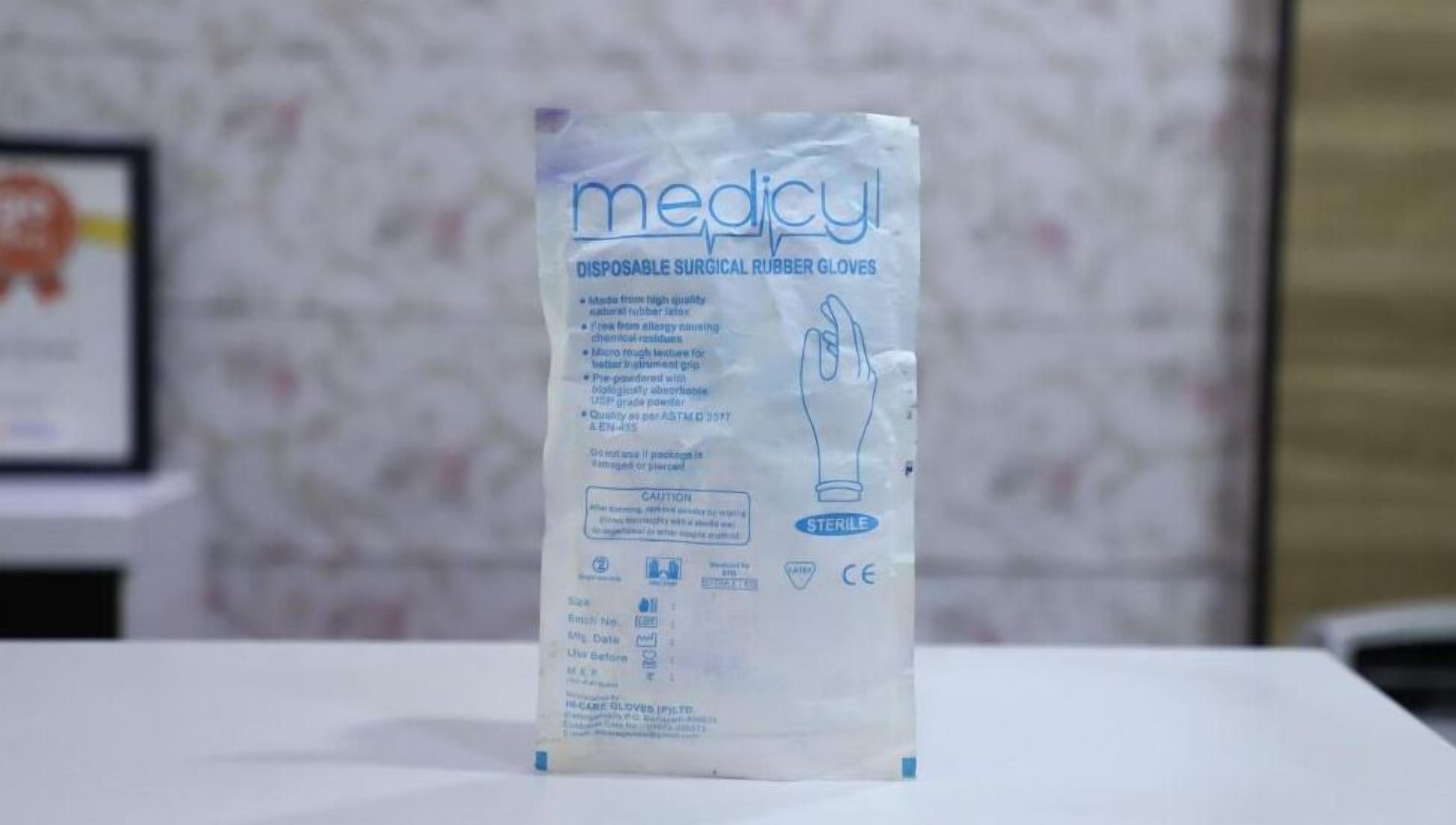 A package of disposable surgical rubber gloves labeled 'medicy' on a white surface.
