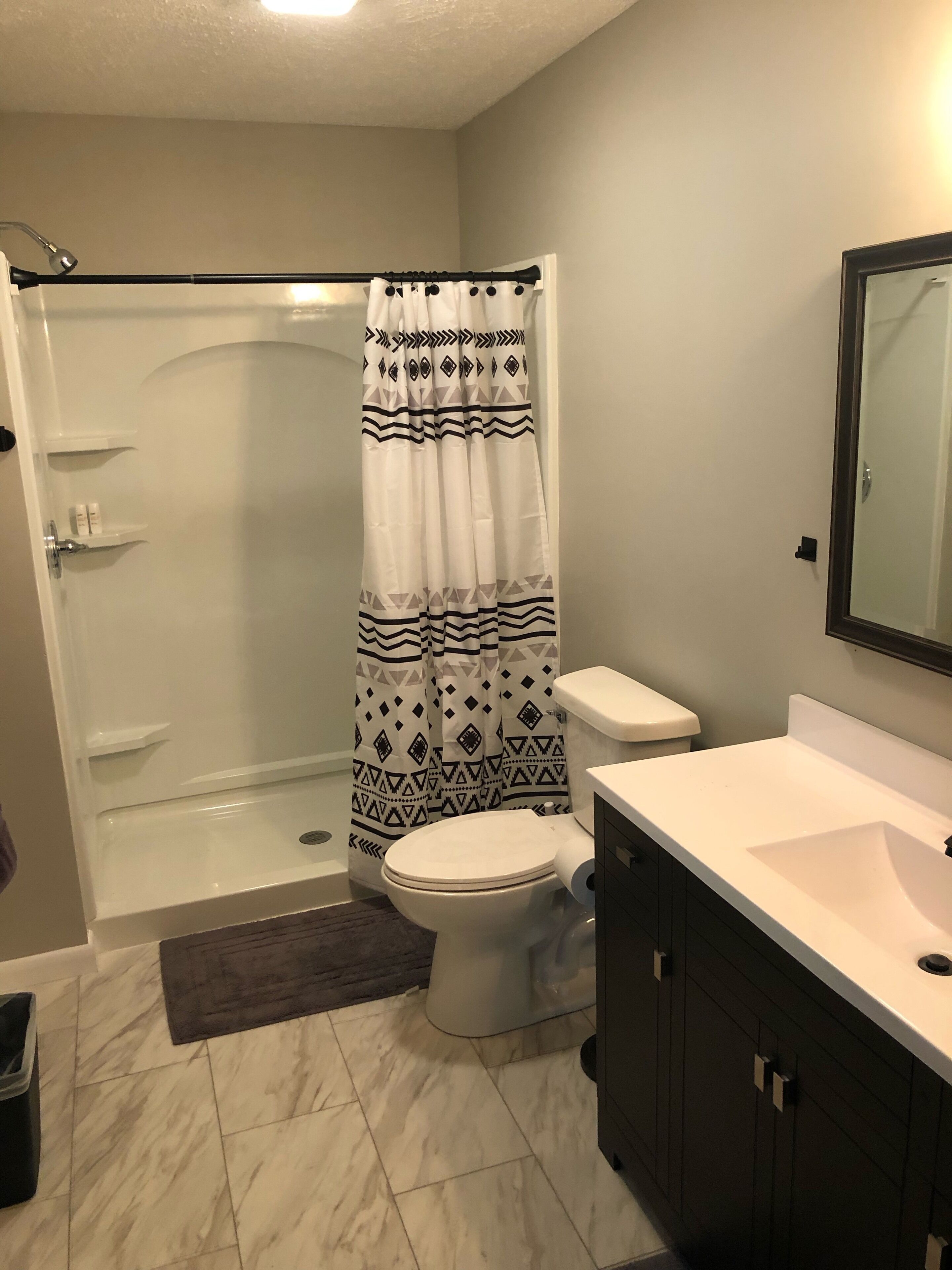 Shower, hair dryer, towels, toilet paper