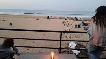 On the beach, beach umbrellas, beach towels, beach yoga