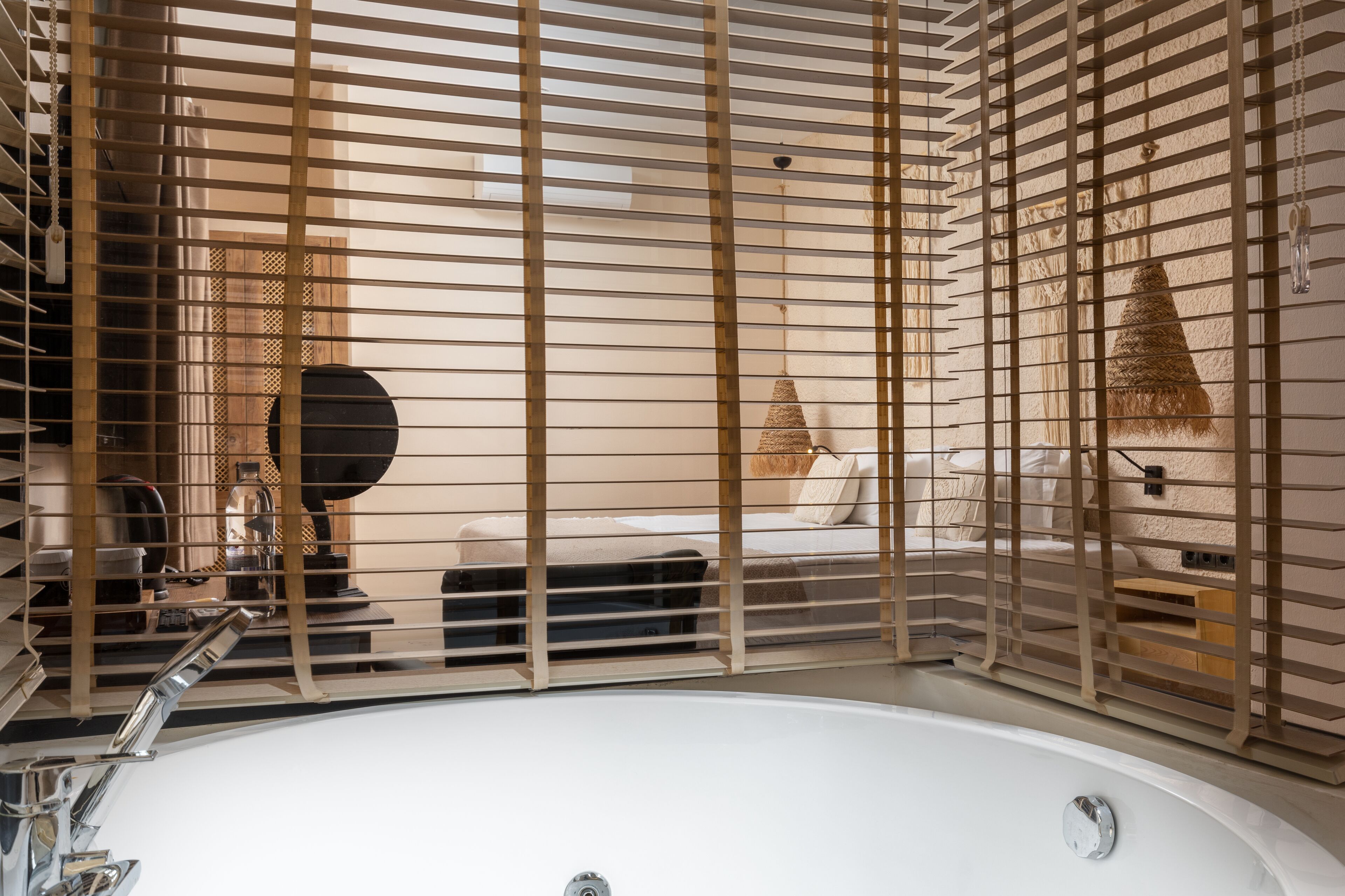 wellness spa suite | bathroom | designer toiletries, hair dryer, slippers, towels