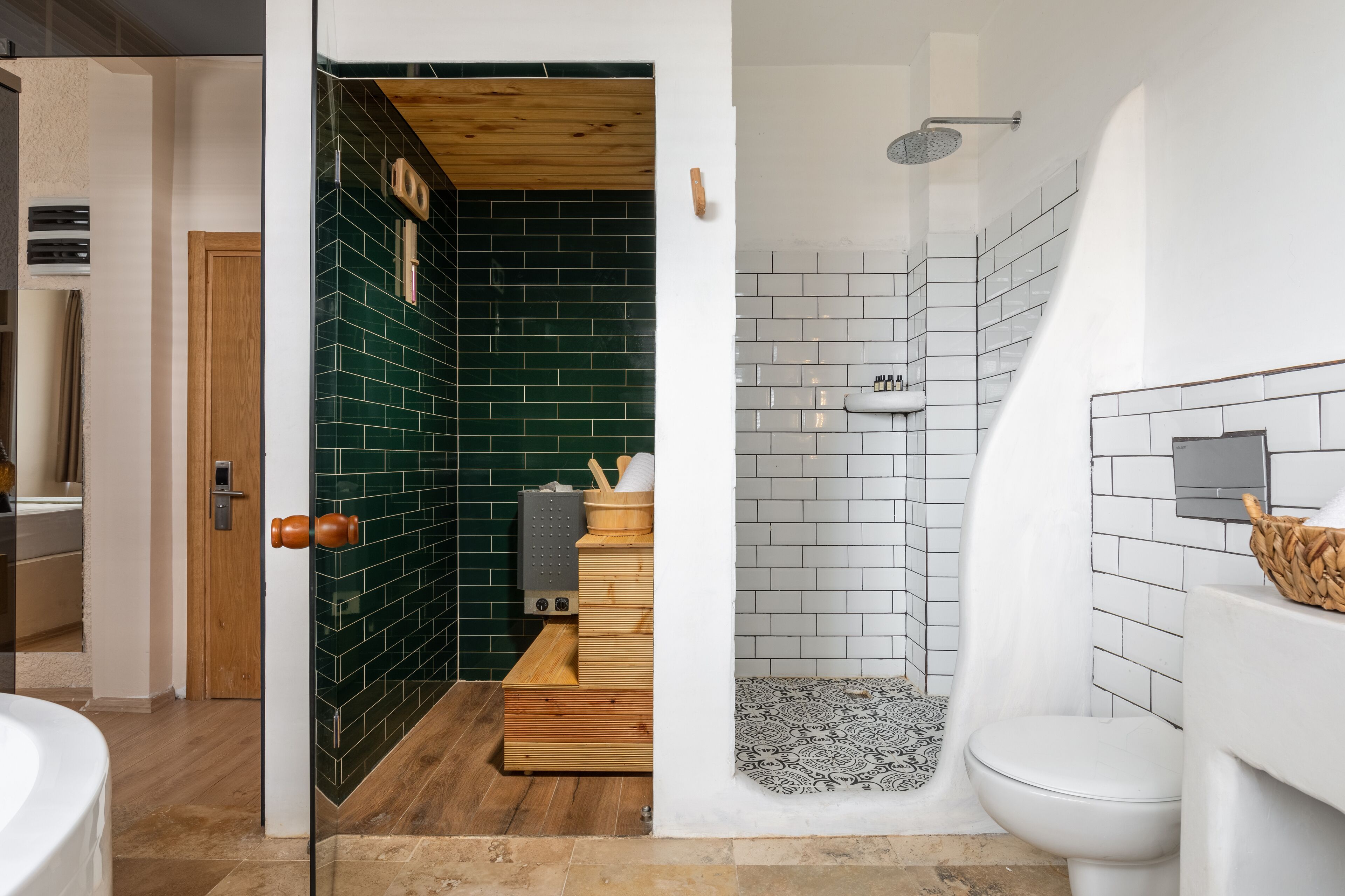 wellness spa suite | bathroom | designer toiletries, hair dryer, slippers, towels