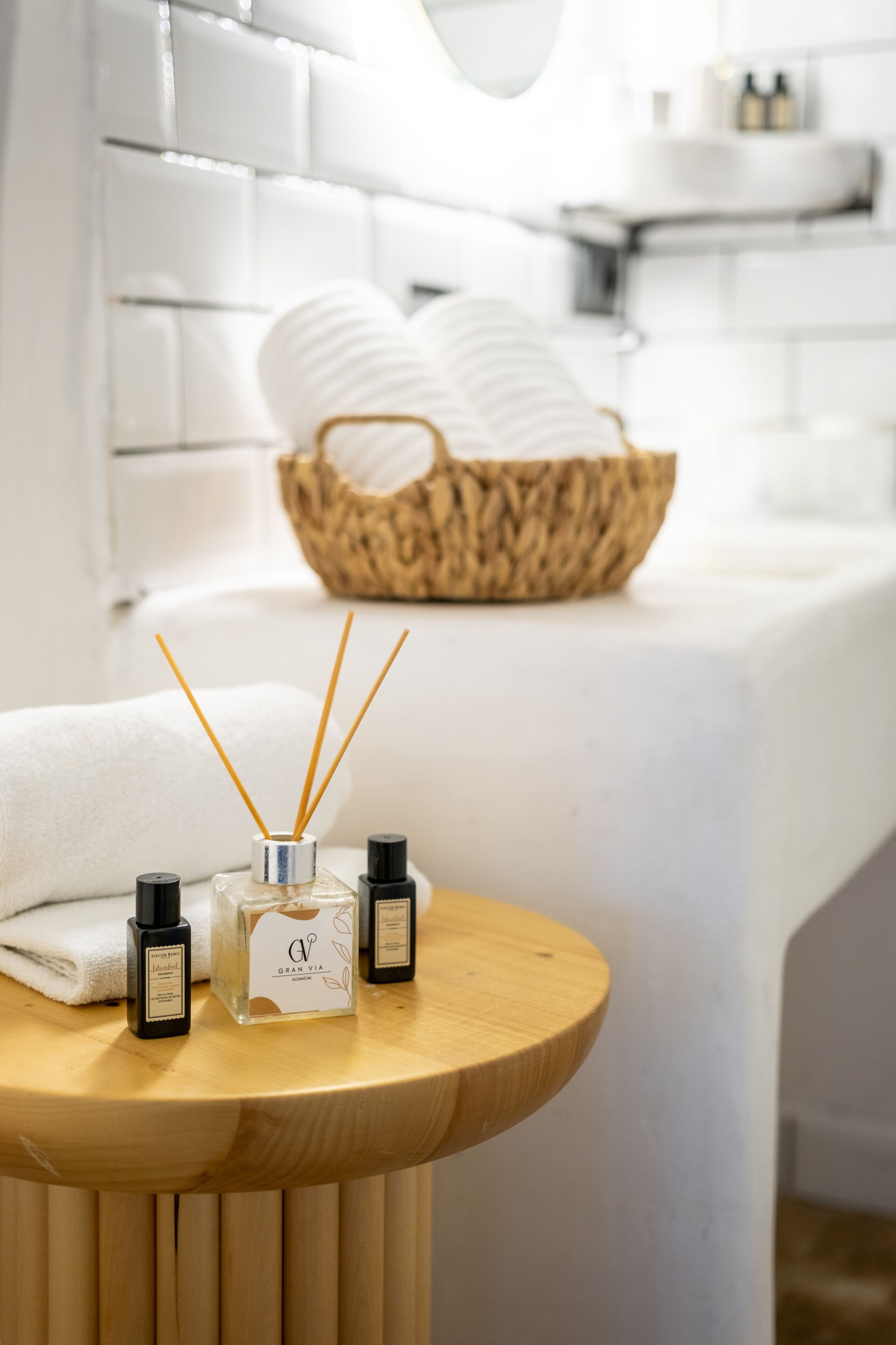 wellness spa suite | bathroom | designer toiletries, hair dryer, slippers, towels
