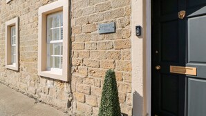 A stone building with a sign reading "Deanery View."
