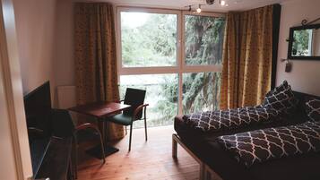 Basic House, Non Smoking, Garden View | Living area | Flat-screen TV