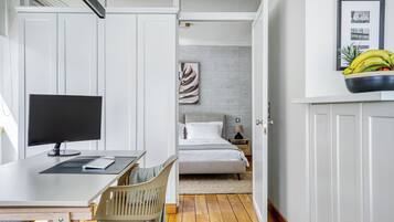 1 bedroom, desk, iron/ironing board, travel crib