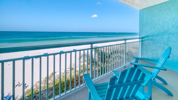 A balcony with a view of the beach and ocean. - DIRECT BEACHFRONT! SWIMMING POOL! (Indian Shores)