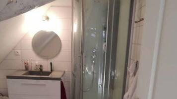 Bathtub, hair dryer, toilet paper