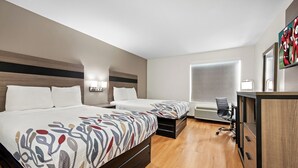 A hotel room with two beds, a desk with a chair, a TV, and a wardrobe. - Red Roof Inn & Suites Houma (Houma)