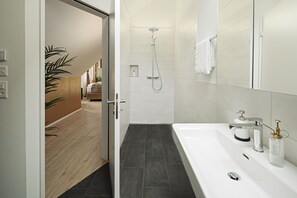 Luxury Studio 45m2 | Bathroom | Shower, rainfall showerhead, hair dryer, towels