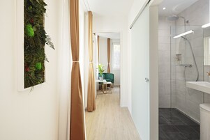 Shower, rainfall showerhead, hair dryer, towels