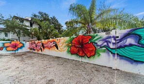 A wall with vibrant floral graffiti art.