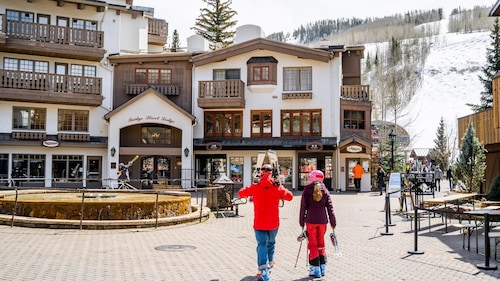 3BR Vail Village condo with mountain views, fireplace, and parking.