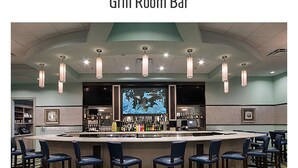A bar area with a counter, bar stools, and a television screen. - 7BR Champions Gate Resort/Private Pool & Spa/15 min to Disney/Sleeps 16+ (Davenport)