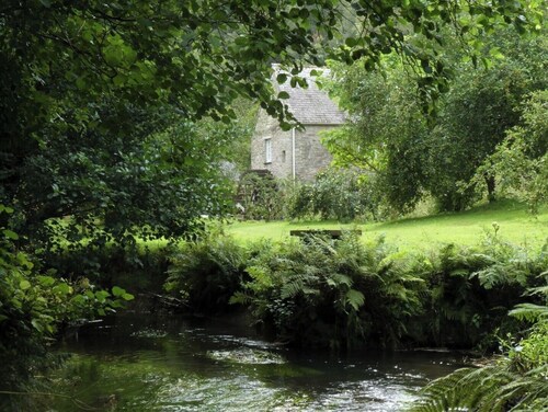 Beautiful converted watermill in a secluded river valley near the sea