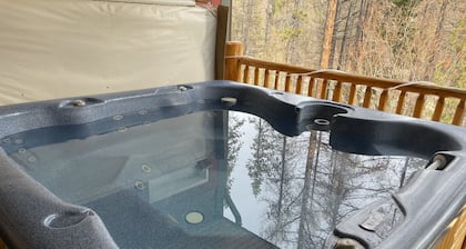 Newly redecorated condo right on the ski hill with private hot tub.