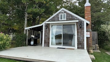Guest house with an entrance and serene surroundings.