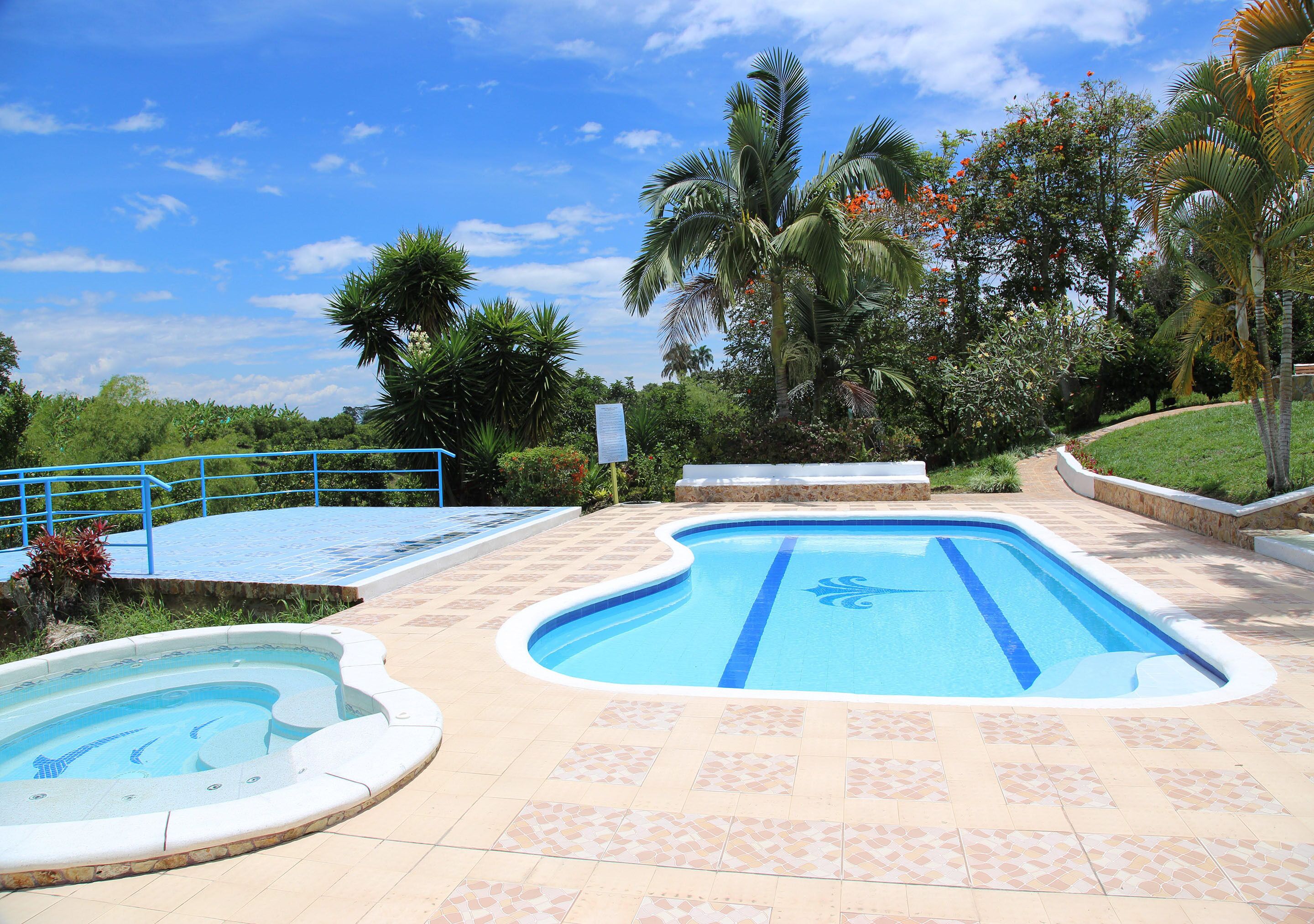 Outdoor pool, pool umbrellas, sun loungers