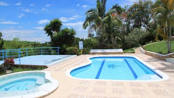 Outdoor pool, pool umbrellas, sun loungers