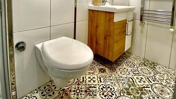 Standard Apartment | Bathroom | Shower, rainfall showerhead, hair dryer, bathrobes