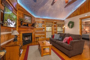 Cabin, 1 King Bed with Sofa bed, Fireplace | Living area | 42-inch flat-screen TV with cable channels, TV, fireplace - Cozy Bears Cabin (Pigeon Forge)