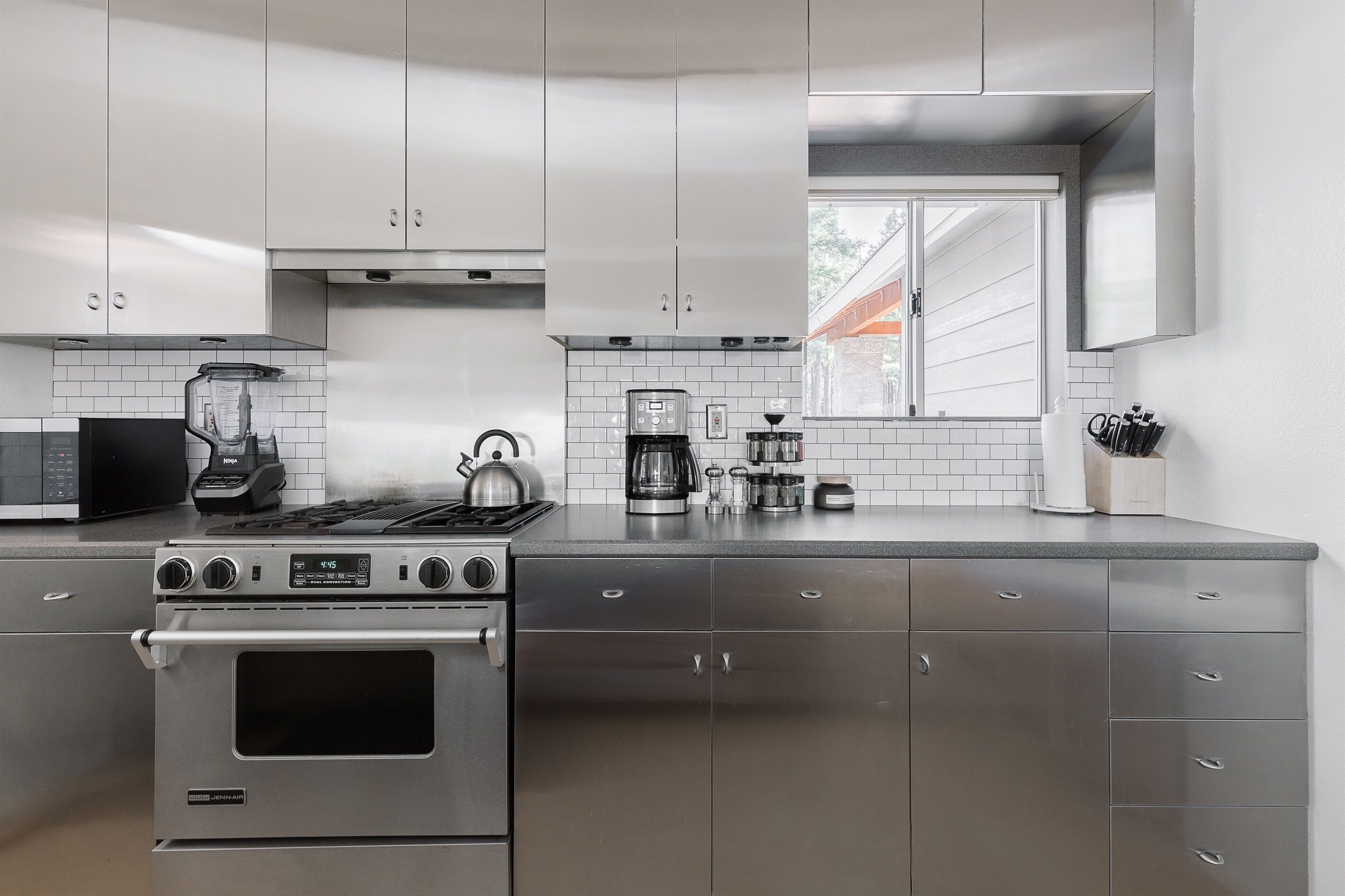 High end kitchen with top of the line Jenn Air gas range.