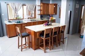 Fridge, microwave, stovetop, coffee/tea maker