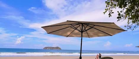 On the beach, sun loungers, beach towels