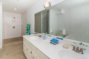 Combined shower/tub, hair dryer, towels, soap