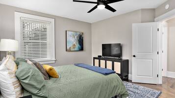 1 bedroom, desk, iron/ironing board, travel crib