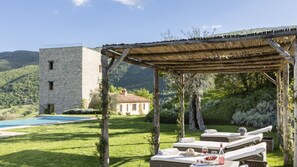 An infinity pool, sun loungers