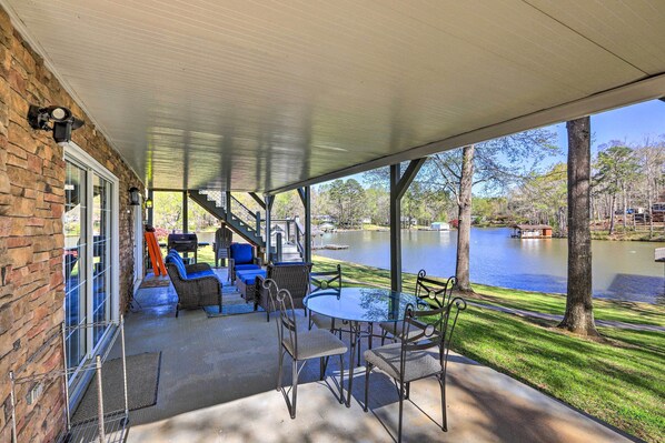 Relax and socialize in this serene patio area with comfortable seating and a stunning view.