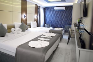 Luxury Triple Room | Premium bedding, minibar, in-room safe, desk