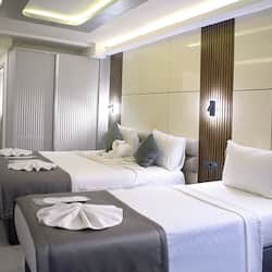 Luxury Triple Room | Premium bedding, minibar, in-room safe, desk