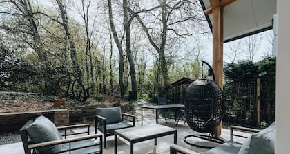 La Folie': a large, elegantly furnished holiday home with plenty of privacy at the back of a green family park.