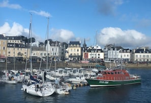 Boats docked along the waterfront, offering a glimpse into the local marina scene.