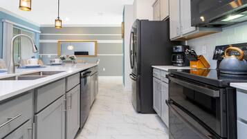 Family Townhome, 4 Bedrooms | Private kitchen | Full-size fridge, microwave, oven, stovetop